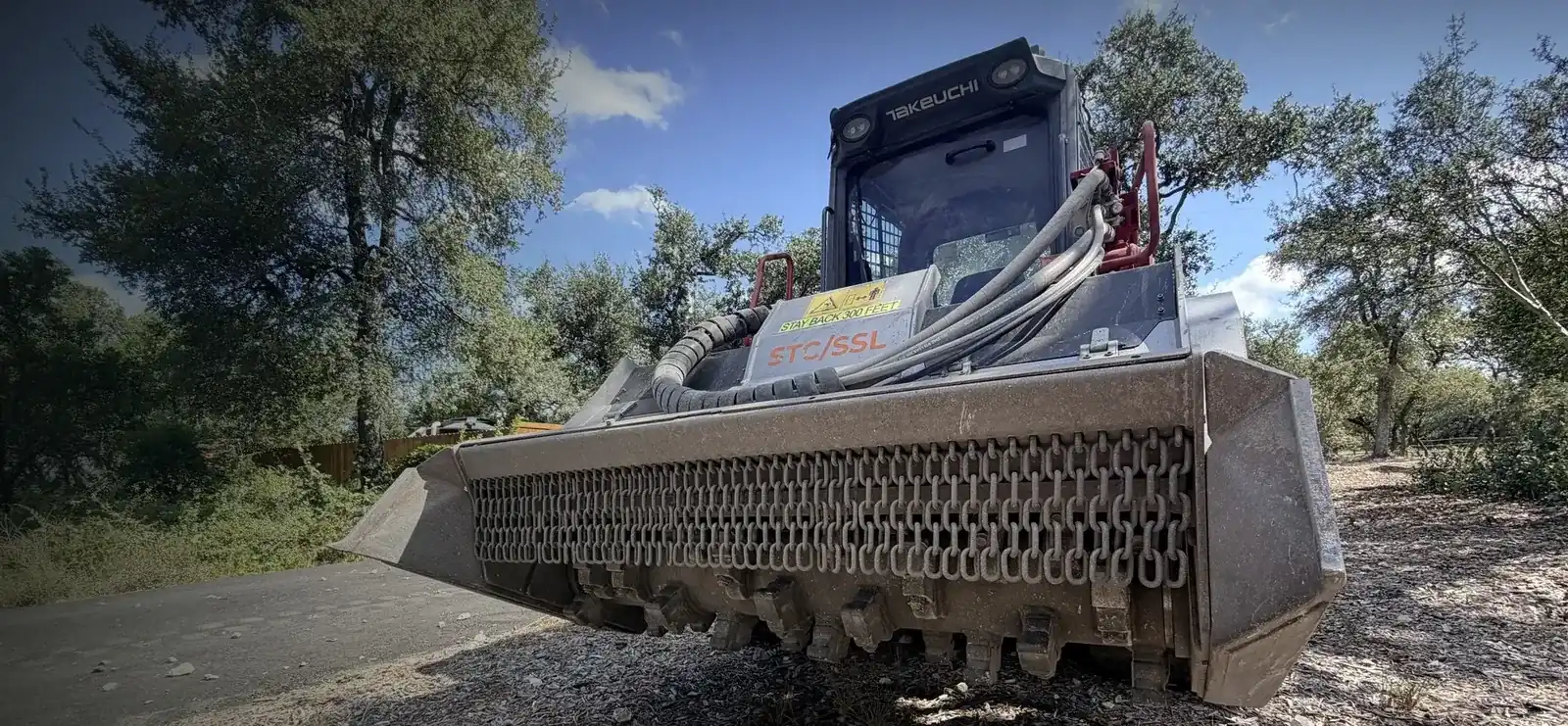 Rock Grinding on a Texas Hill Country property — Break down boulders and rocky terrain for construction or development.